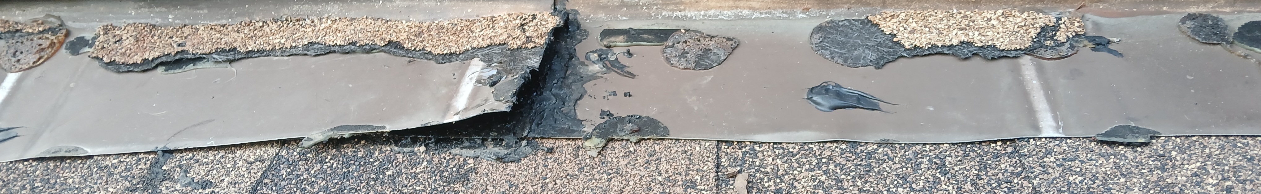 Botched roof repair by Summit Roofing showing unresolved leak area